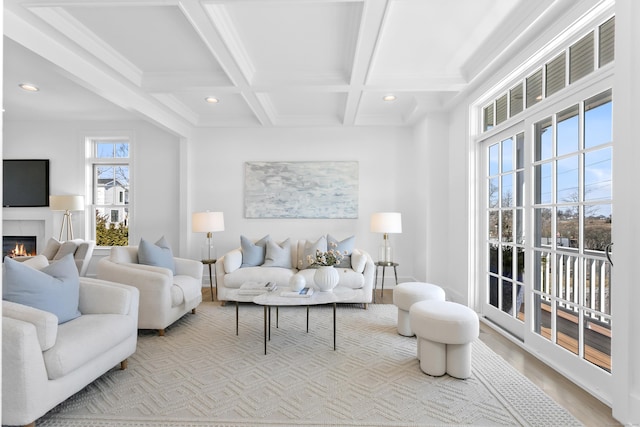 40 Fairfield Beach Rd, Fairfield, CT 06824 - living area with beamed ceiling, recessed lighting, coffered ceiling, wood finished floors, and a glass covered fireplace