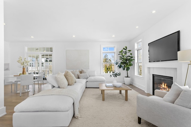 40 Fairfield Beach Rd, Fairfield, CT 06824 - living area featuring recessed lighting, wood finished floors, a glass covered fireplace, and baseboards