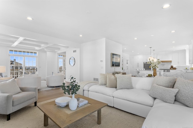 40 Fairfield Beach Rd, Fairfield, CT 06824 - living area with coffered ceiling, recessed lighting, beamed ceiling, and light wood-style floors