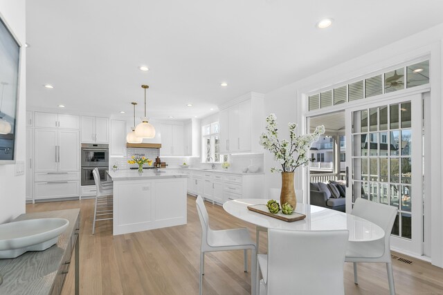 40 Fairfield Beach Rd, Fairfield, CT 06824 - dining area with light wood-style floors and recessed lighting