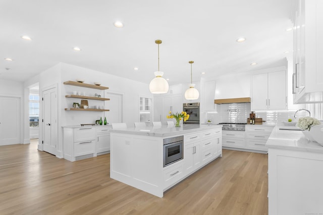 40 Fairfield Beach Rd, Fairfield, CT 06824 - kitchen featuring a sink, stainless steel appliances, open shelves, a kitchen island, and decorative backsplash