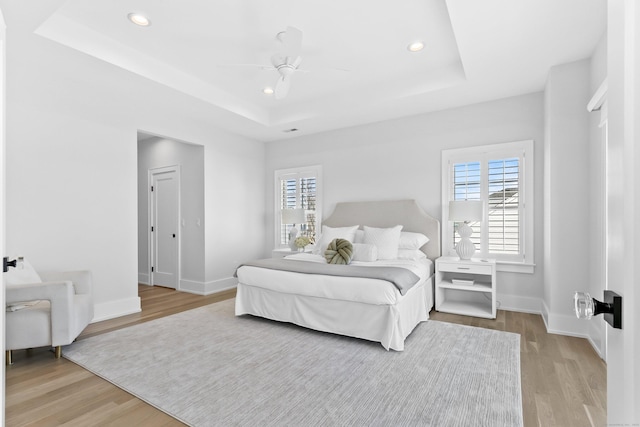 40 Fairfield Beach Rd, Fairfield, CT 06824 - bedroom with a tray ceiling, wood finished floors, baseboards, recessed lighting, and a ceiling fan