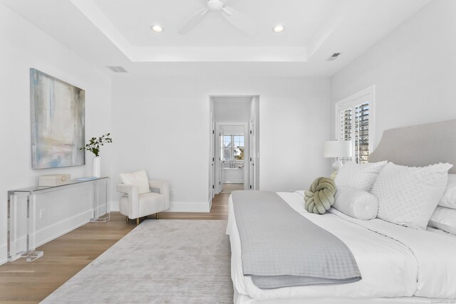 40 Fairfield Beach Rd, Fairfield, CT 06824 - bedroom featuring wood finished floors, a tray ceiling, recessed lighting, ceiling fan, and baseboards