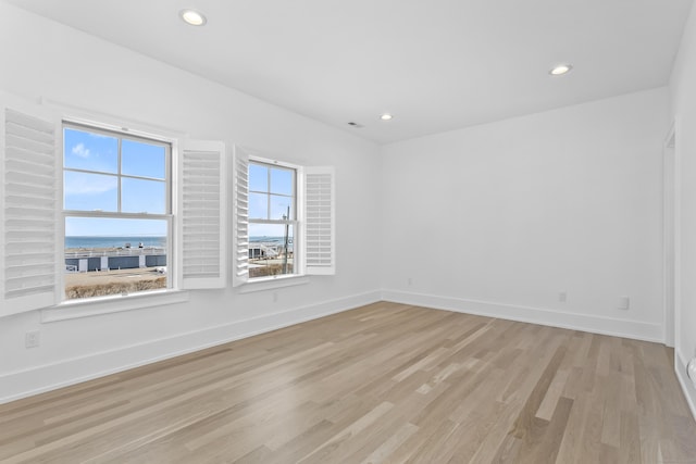 40 Fairfield Beach Rd, Fairfield, CT 06824 - empty room featuring light wood-style flooring, recessed lighting, and baseboards