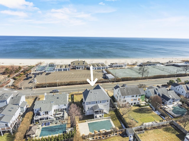 bird's eye view featuring a beach view and a water view