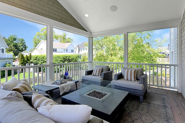 40 Fairfield Beach Rd, Fairfield, CT 06824 - sunroom with an outdoor living space with a fire pit, lofted ceiling, and a residential view