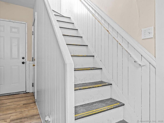 staircase with wood finished floors