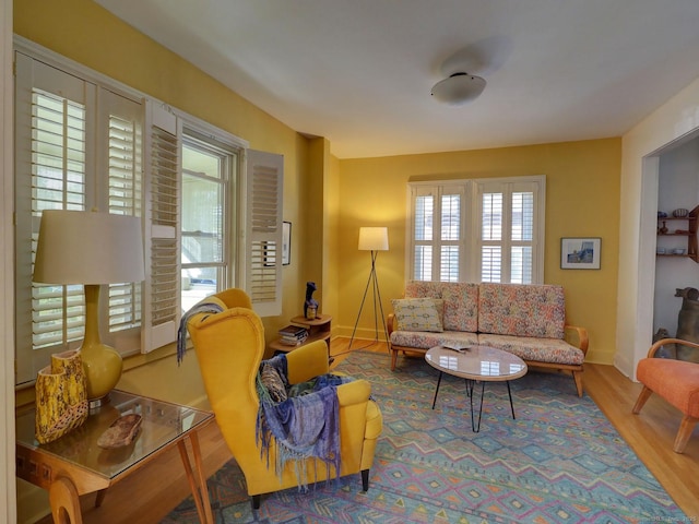 living room with wood finished floors and baseboards