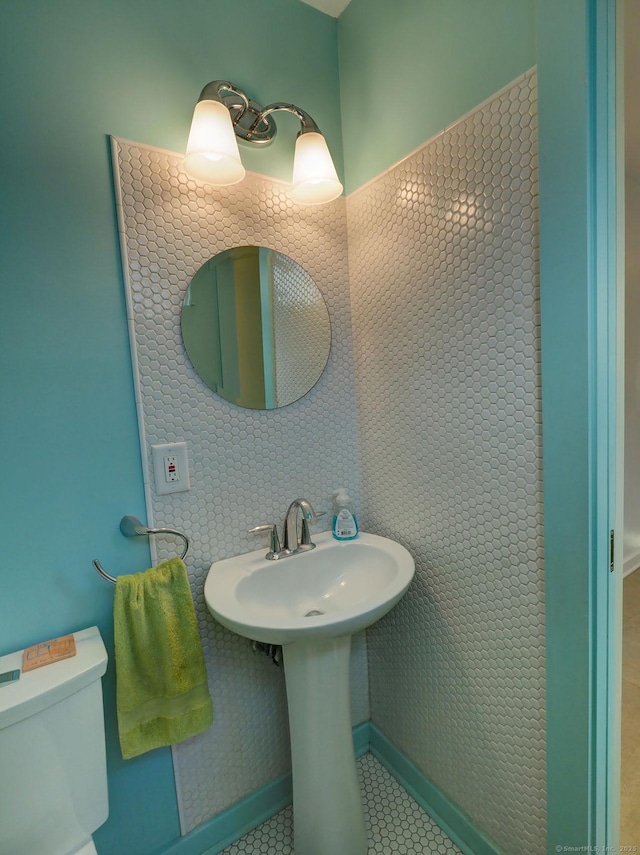 bathroom featuring tile patterned flooring and toilet