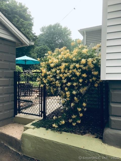 view of gate featuring fence