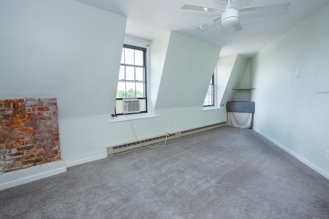 additional living space with baseboards, a ceiling fan, a baseboard radiator, carpet, and cooling unit