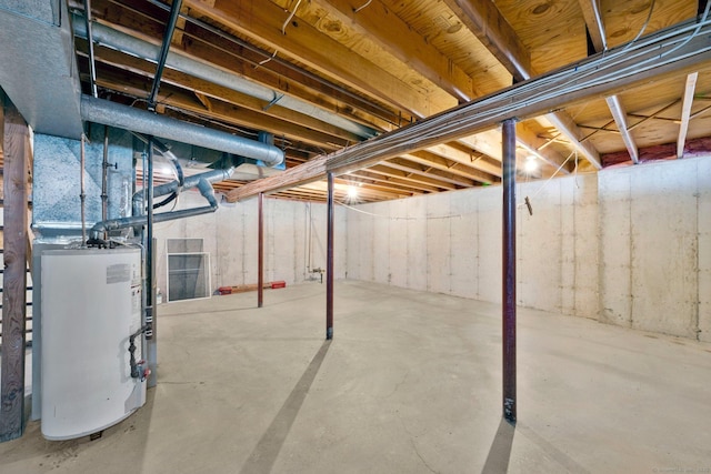 unfinished basement featuring water heater