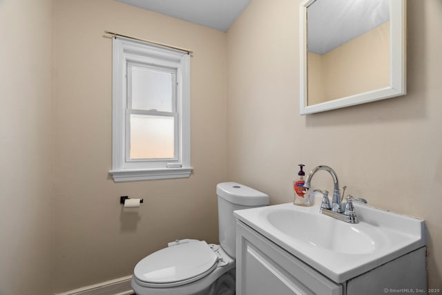 bathroom featuring toilet and vanity