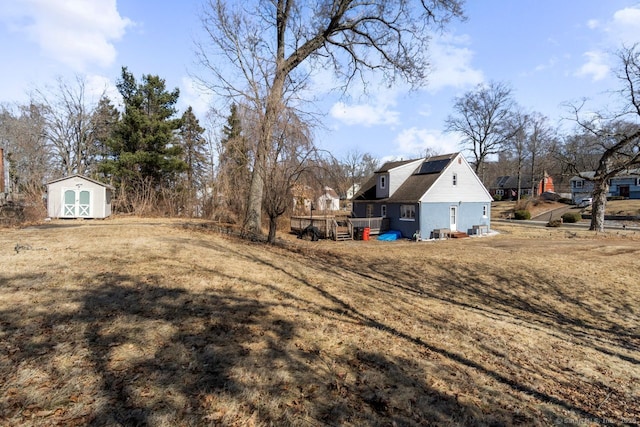 view of yard with a shed and an outdoor structure