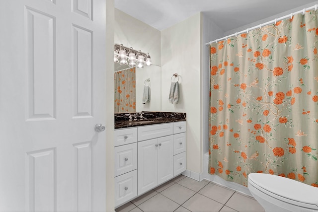 full bath with shower / tub combo with curtain, toilet, vanity, tile patterned flooring, and baseboards