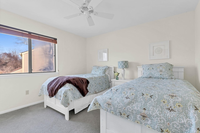 bedroom with ceiling fan, carpet floors, and baseboards