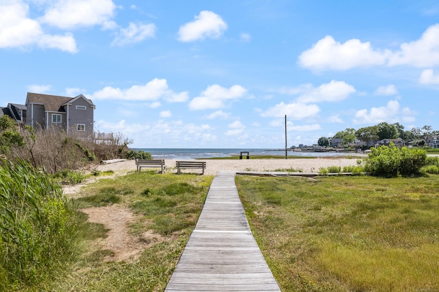 view of community with a water view