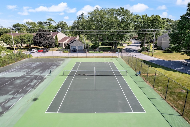 view of sport court with fence