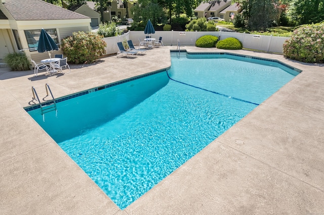 view of swimming pool with a patio area, a fenced backyard, and a fenced in pool