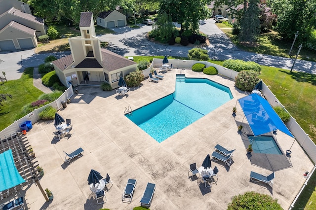 community pool featuring a patio area and fence