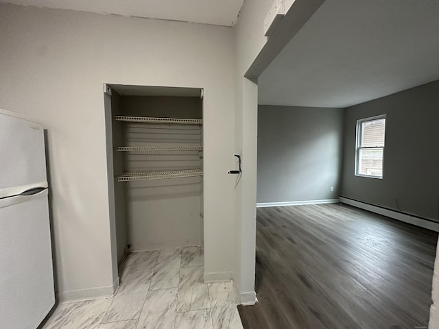 closet featuring a baseboard radiator