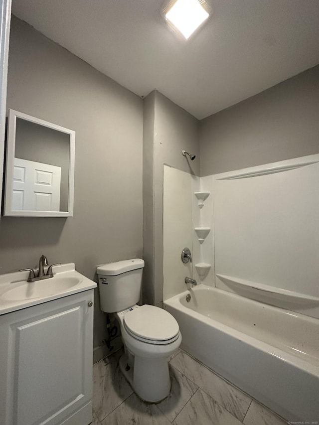 full bath with marble finish floor, vanity, shower / tub combination, and toilet