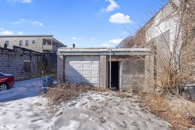 view of snow covered garage