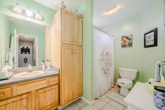 bathroom featuring toilet, curtained shower, tile patterned flooring, and vanity