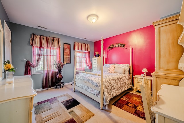 bedroom with carpet floors, visible vents, and baseboards