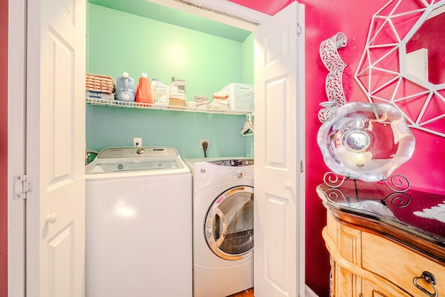 clothes washing area with laundry area and independent washer and dryer