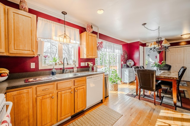 kitchen with light wood-style flooring, decorative light fixtures, white dishwasher, crown molding, and a sink