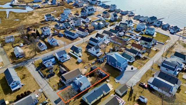 bird's eye view featuring a water view and a residential view