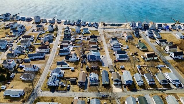 bird's eye view featuring a residential view and a water view