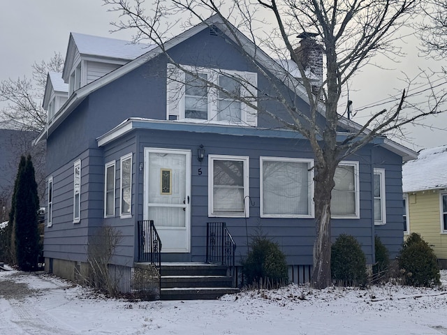 bungalow-style home with entry steps