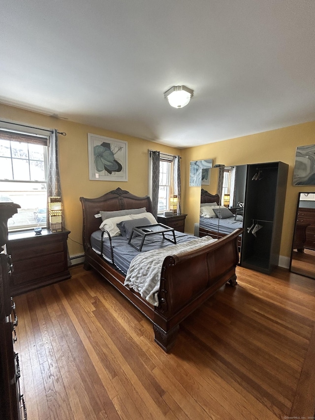 137 Fountain St Apt A7, New Haven, CT 06515 - bedroom with baseboards, baseboard heating, and wood finished floors