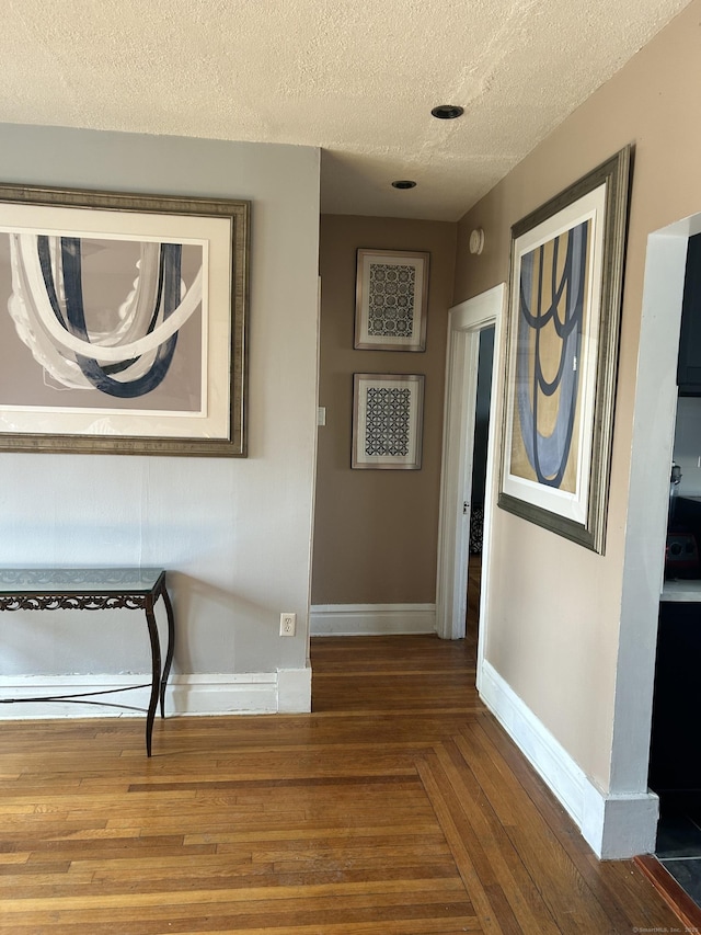 137 Fountain St Apt A7, New Haven, CT 06515 - hall featuring a textured ceiling, dark wood-type flooring, and baseboards