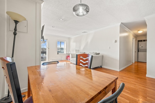 dining room with baseboards, a textured ceiling, light wood-style flooring, and crown molding