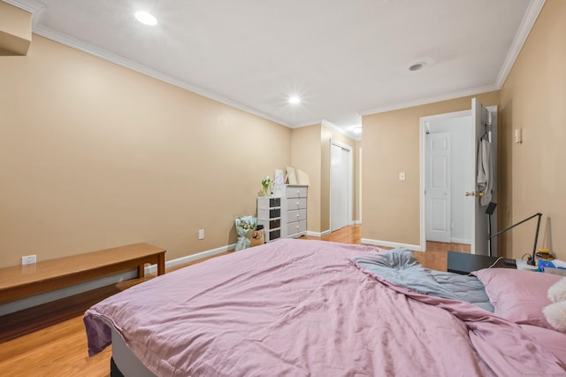 bedroom with recessed lighting, light wood-type flooring, baseboards, and ornamental molding