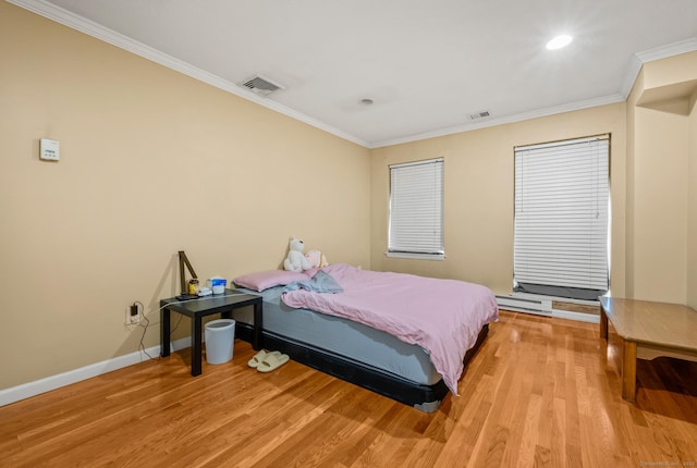 bedroom featuring light wood-type flooring, visible vents, crown molding, baseboards, and baseboard heating