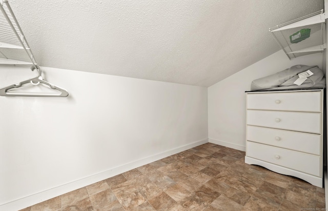 spacious closet featuring lofted ceiling