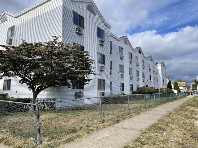 view of property with fence