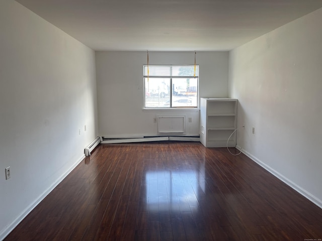 empty room featuring baseboards and dark wood-style flooring