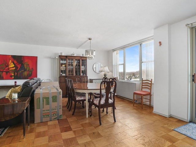 dining room featuring a notable chandelier