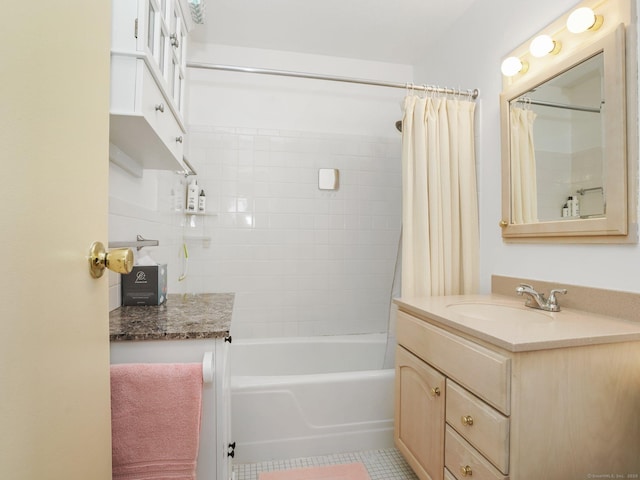 bathroom featuring shower / bath combo with shower curtain, vanity, and tile patterned floors