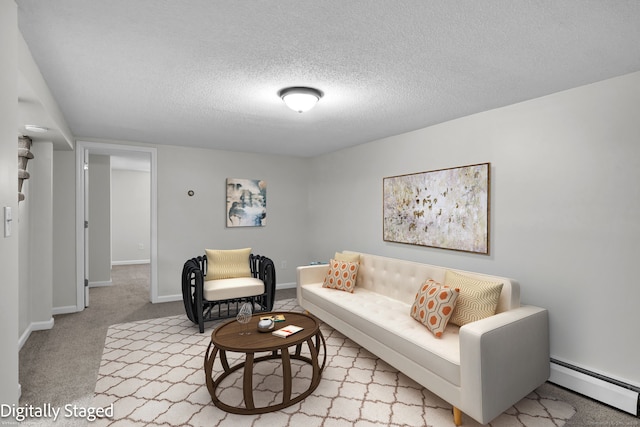 carpeted living room with baseboards, a baseboard heating unit, and a textured ceiling