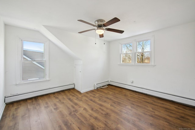 bonus room featuring a ceiling fan, a baseboard radiator, and dark wood-style flooring