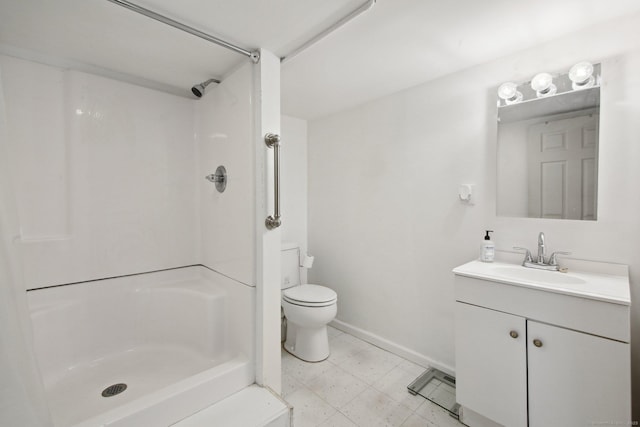 full bathroom with a shower, toilet, vanity, baseboards, and tile patterned floors