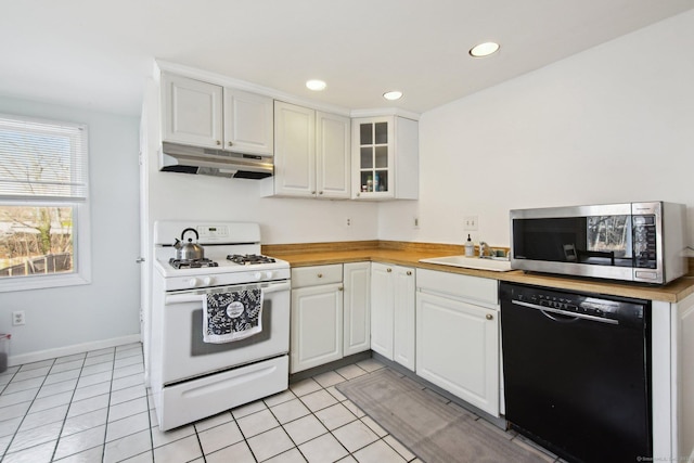 kitchen with black dishwasher, glass insert cabinets, stainless steel microwave, under cabinet range hood, and gas range gas stove