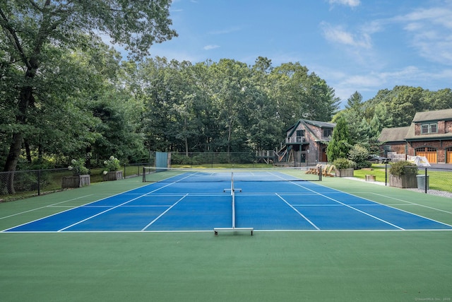 view of sport court with fence