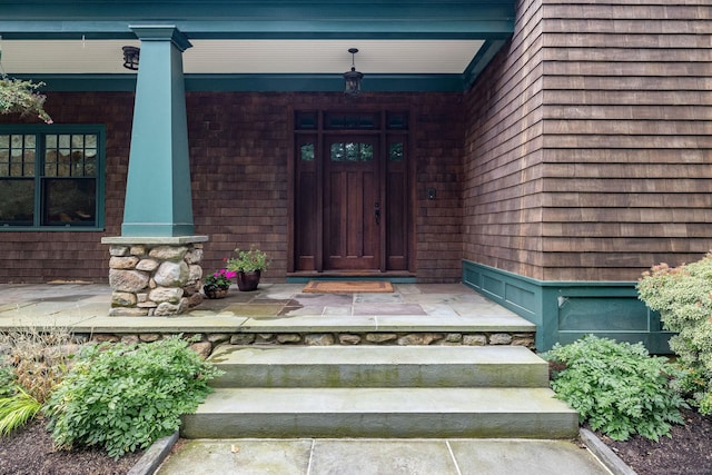 entrance to property featuring covered porch